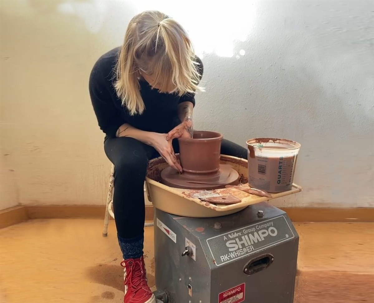 woman throwing pottery on Shimpo RK-Whisper potters wheel